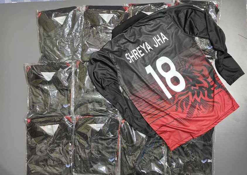 stack of custom sports jerseys with one customized on top showing player name and number.