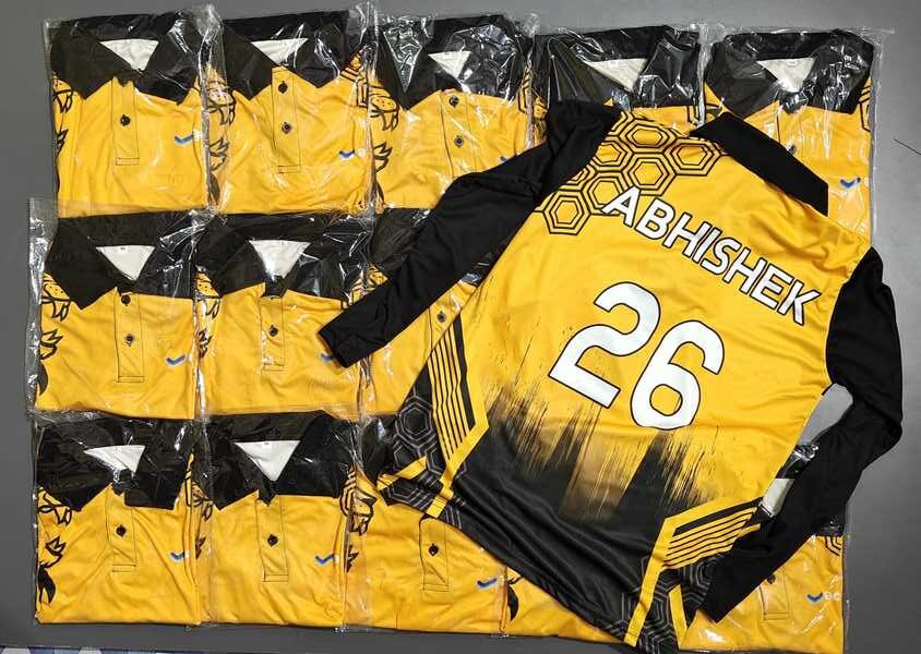 stack of custom sports jerseys with one customized on top showing player name and number.